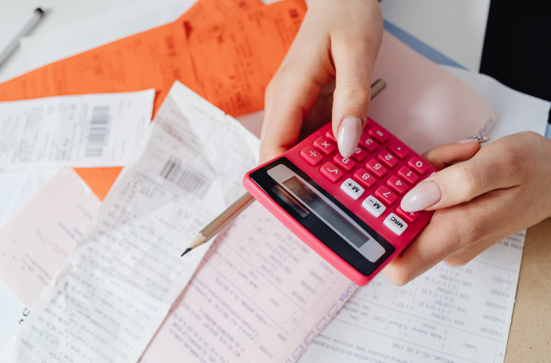 Woman using calculator