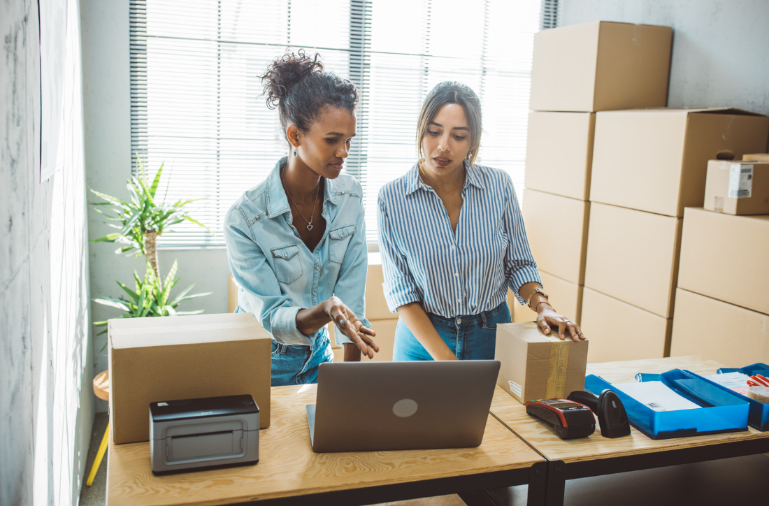 Two women surrounded by boxes