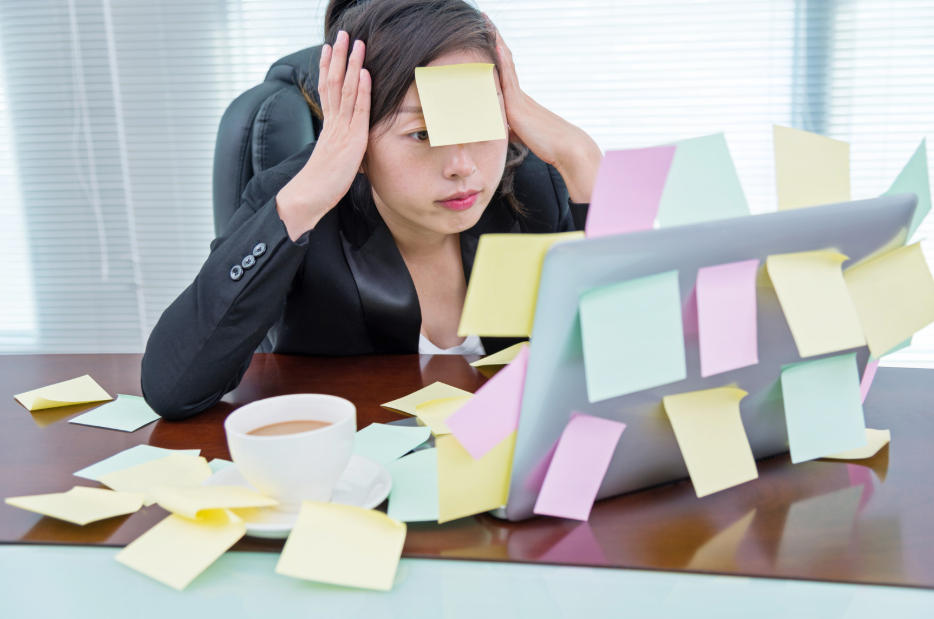 Overwhelmed woman at work