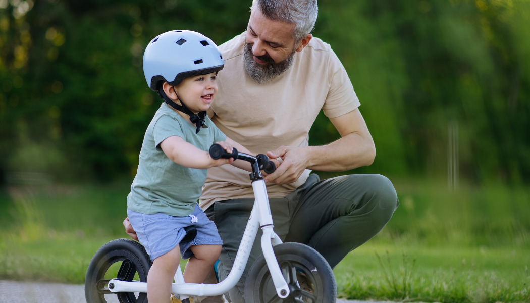 dad and son riding bike