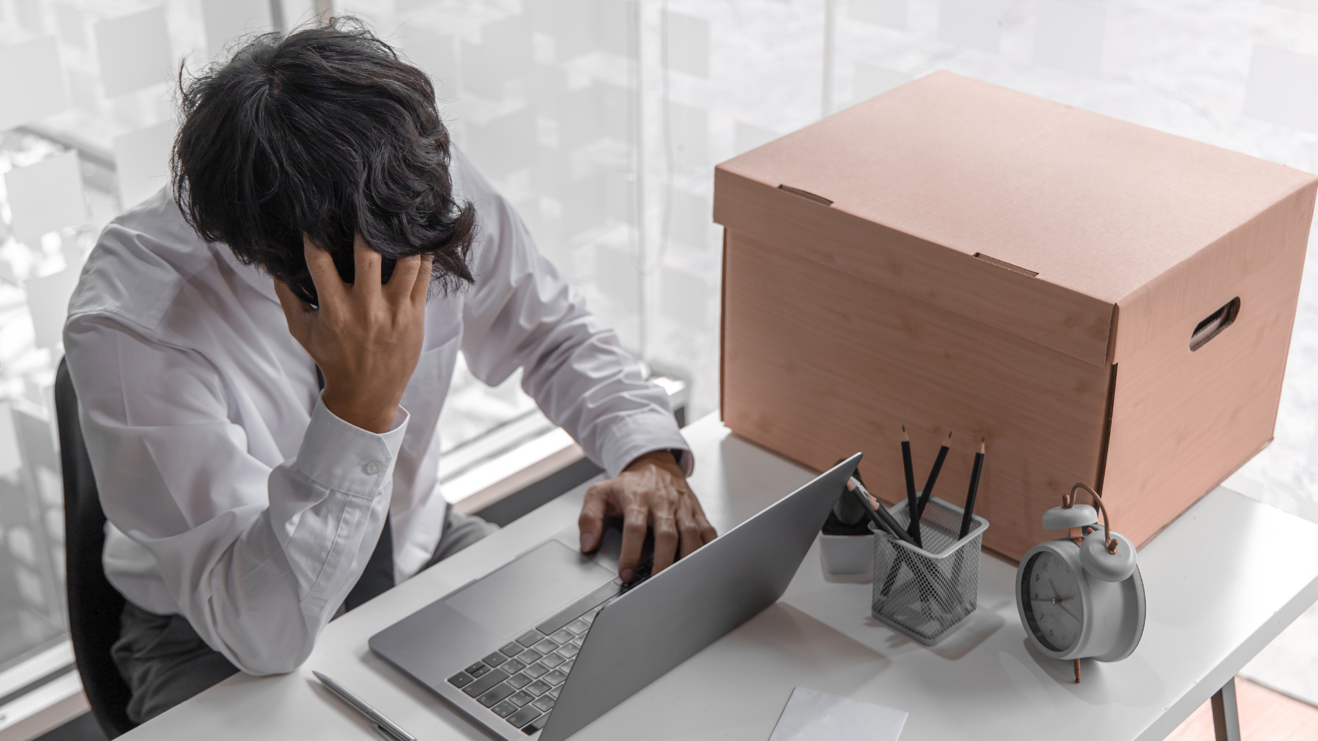 man packing up his office