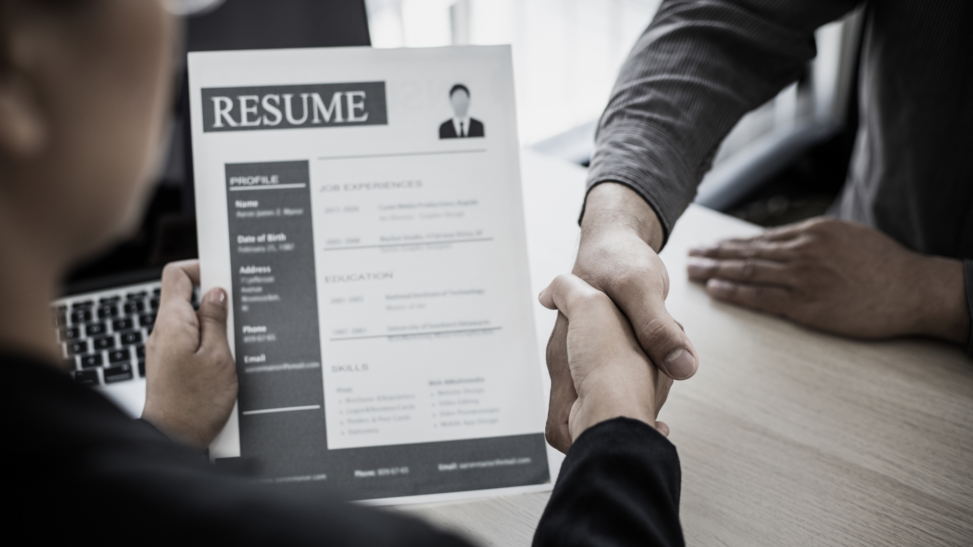 picture holding up a resume