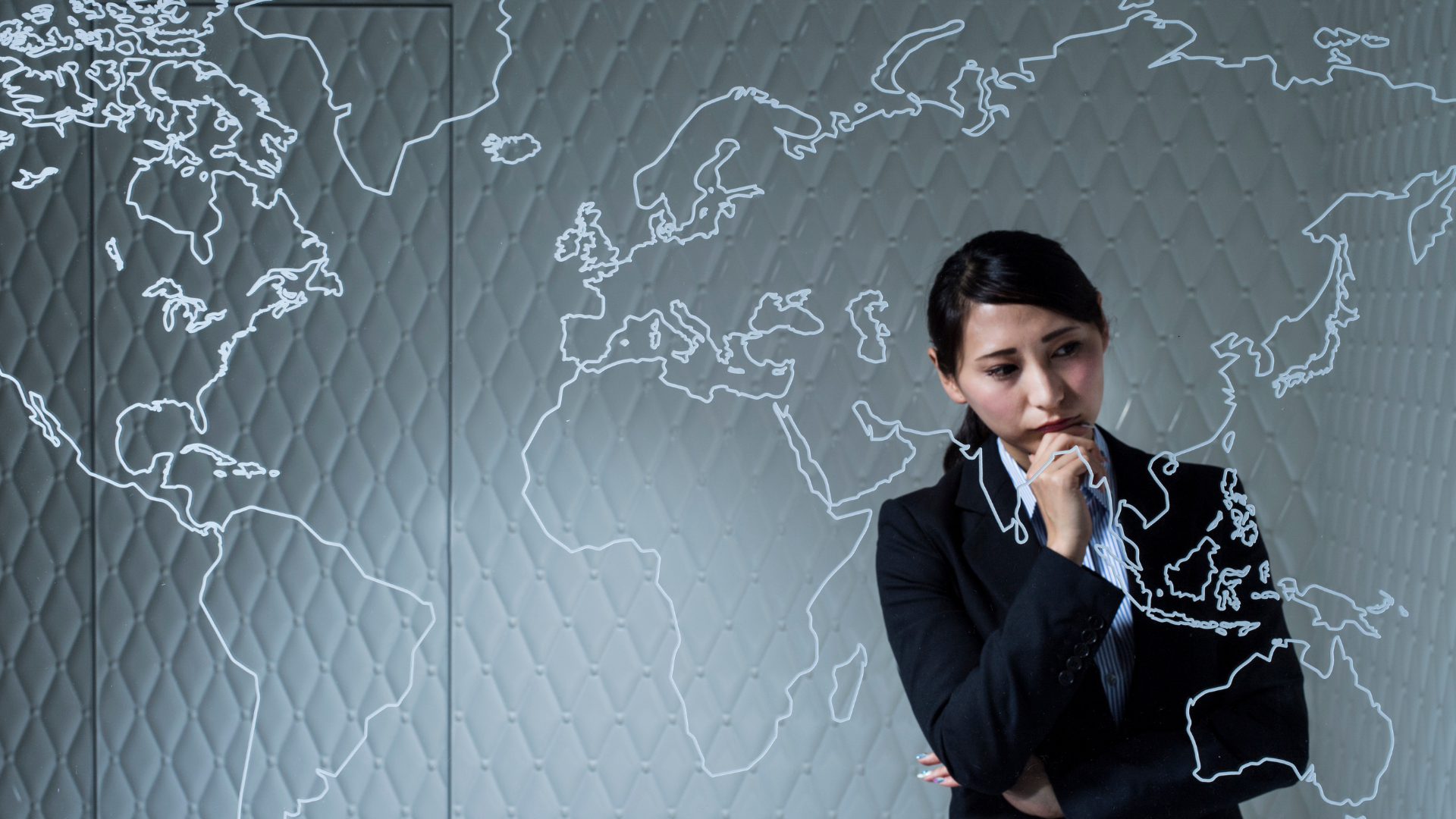 woman staring at a map