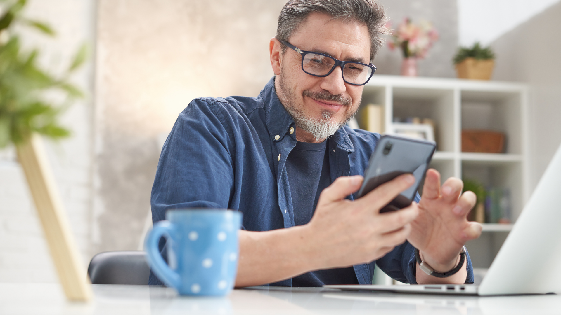man on phone with glasses on
